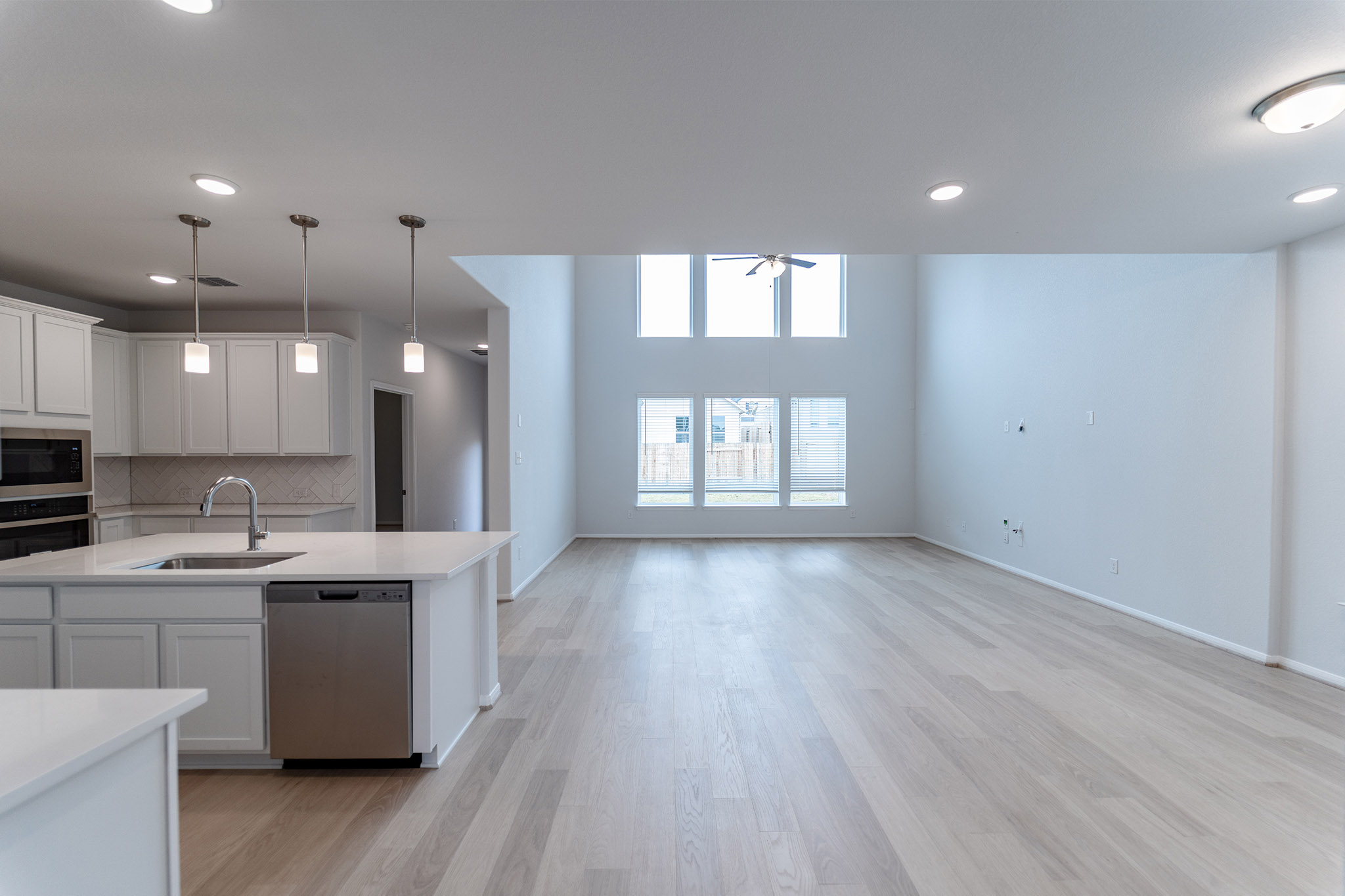 161 Mango Circle Buda, TX 78610 - Photo 22 of 22 a view of a kitchen with a sink and dish washer