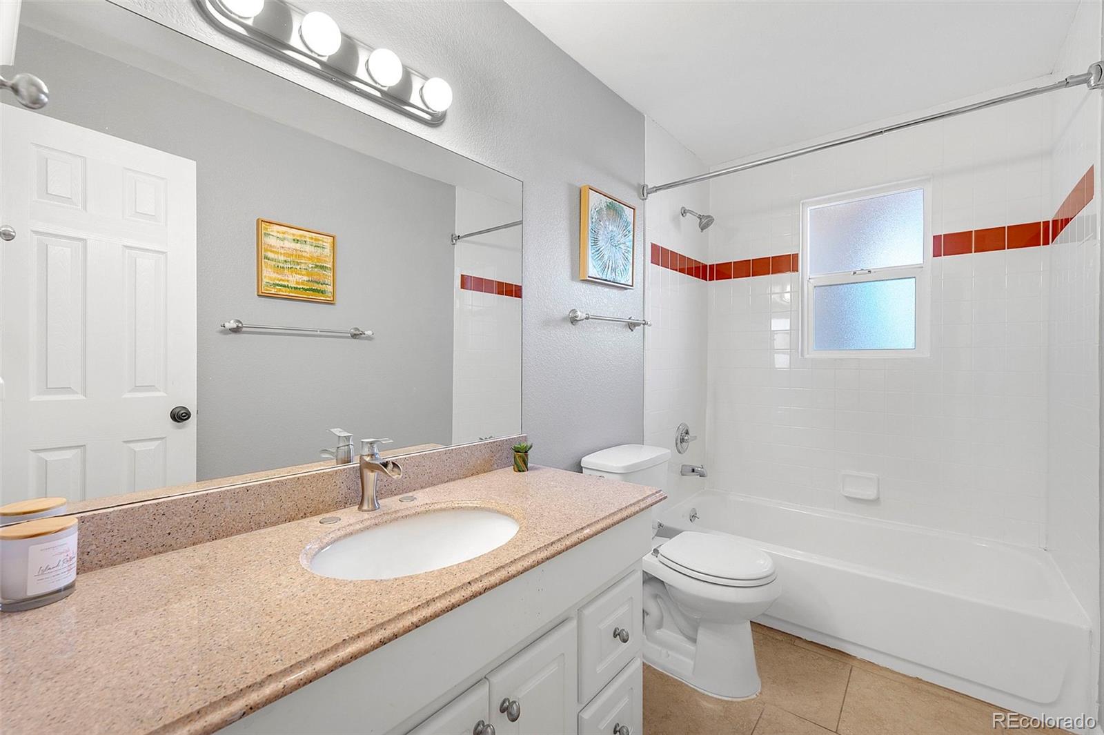 809 5th Street, Unit 201 Golden, CO 80403 - Photo 16 of 32 a bathroom with a granite countertop sink and a mirror