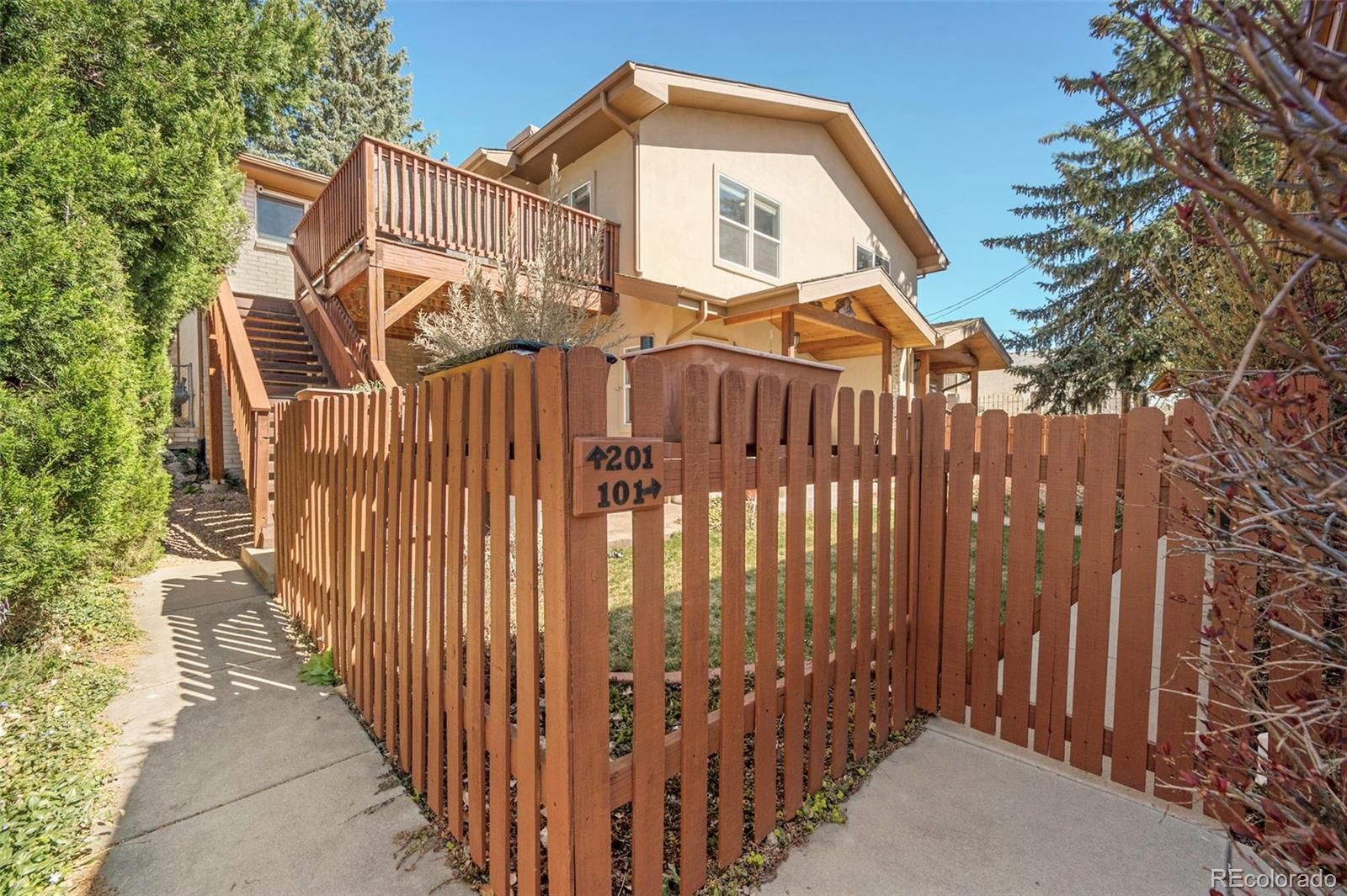 809 5th Street, Unit 201 Golden, CO 80403 - Photo 2 of 32 a view of a house with a small yard