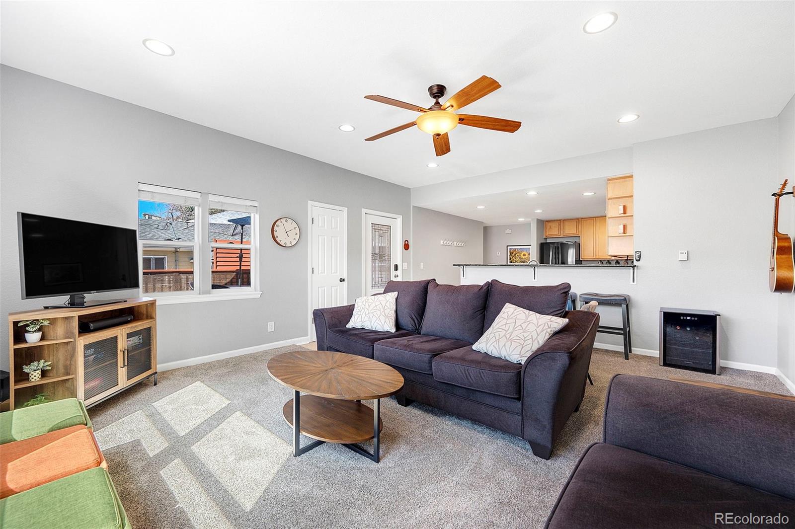 809 5th Street, Unit 201 Golden, CO 80403 - Photo 5 of 32 a living room with furniture and a flat screen tv