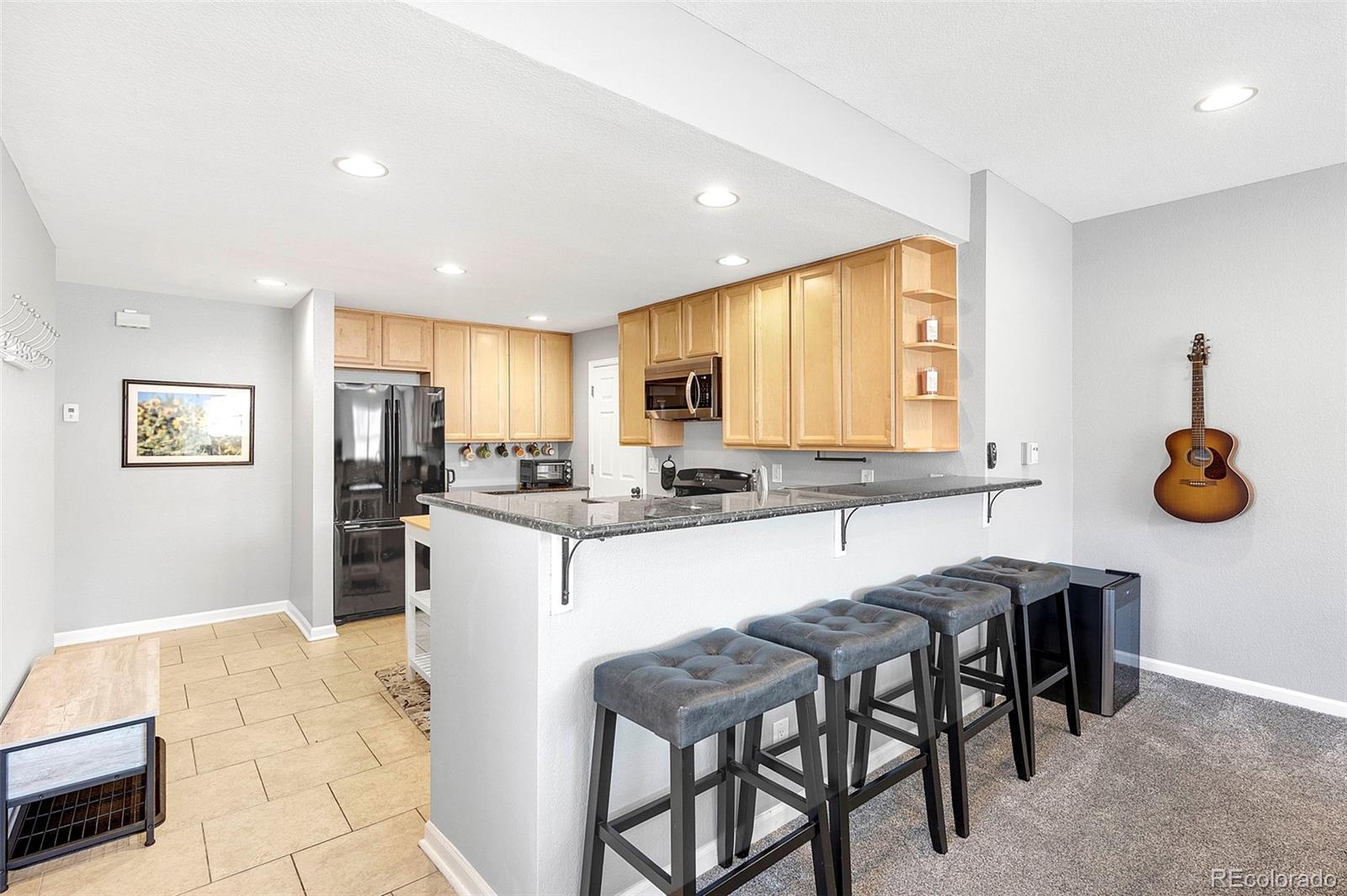 809 5th Street, Unit 201 Golden, CO 80403 - Photo 6 of 32 a kitchen with a table and chairs in it