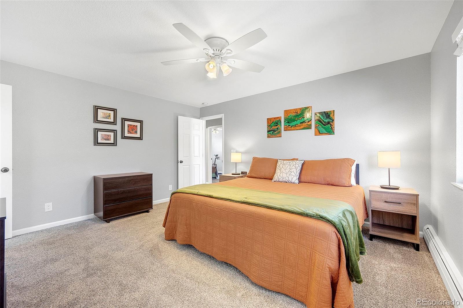 809 5th Street, Unit 201 Golden, CO 80403 - Photo 9 of 32 a bedroom with a bed and a chandelier
