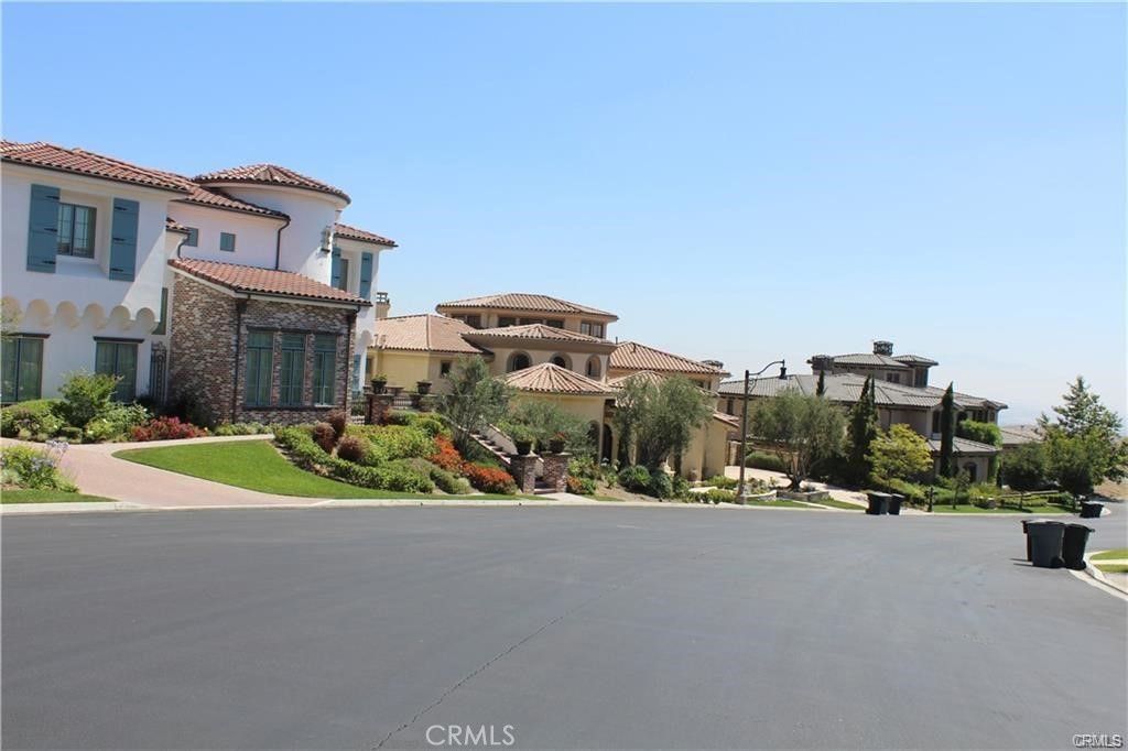 2572 Collinas Point Chino Hills, CA 91709 - Photo 18 of 28 a view of a house with a yard and potted plants