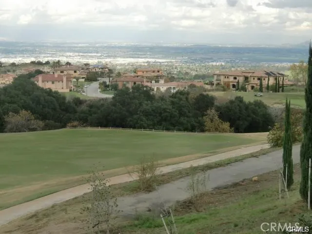 a view of a big yard with houses