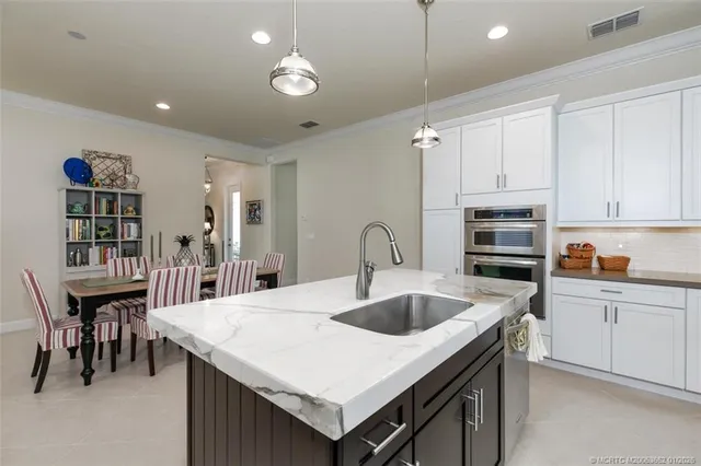 a kitchen that has a table and chairs in it