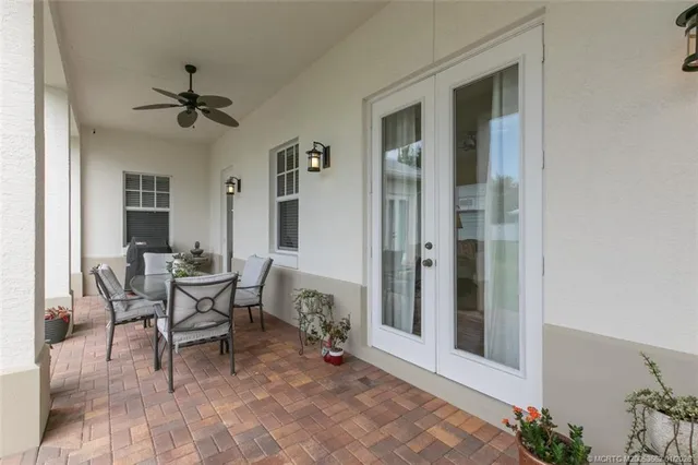 a view of a livingroom with furniture and a window