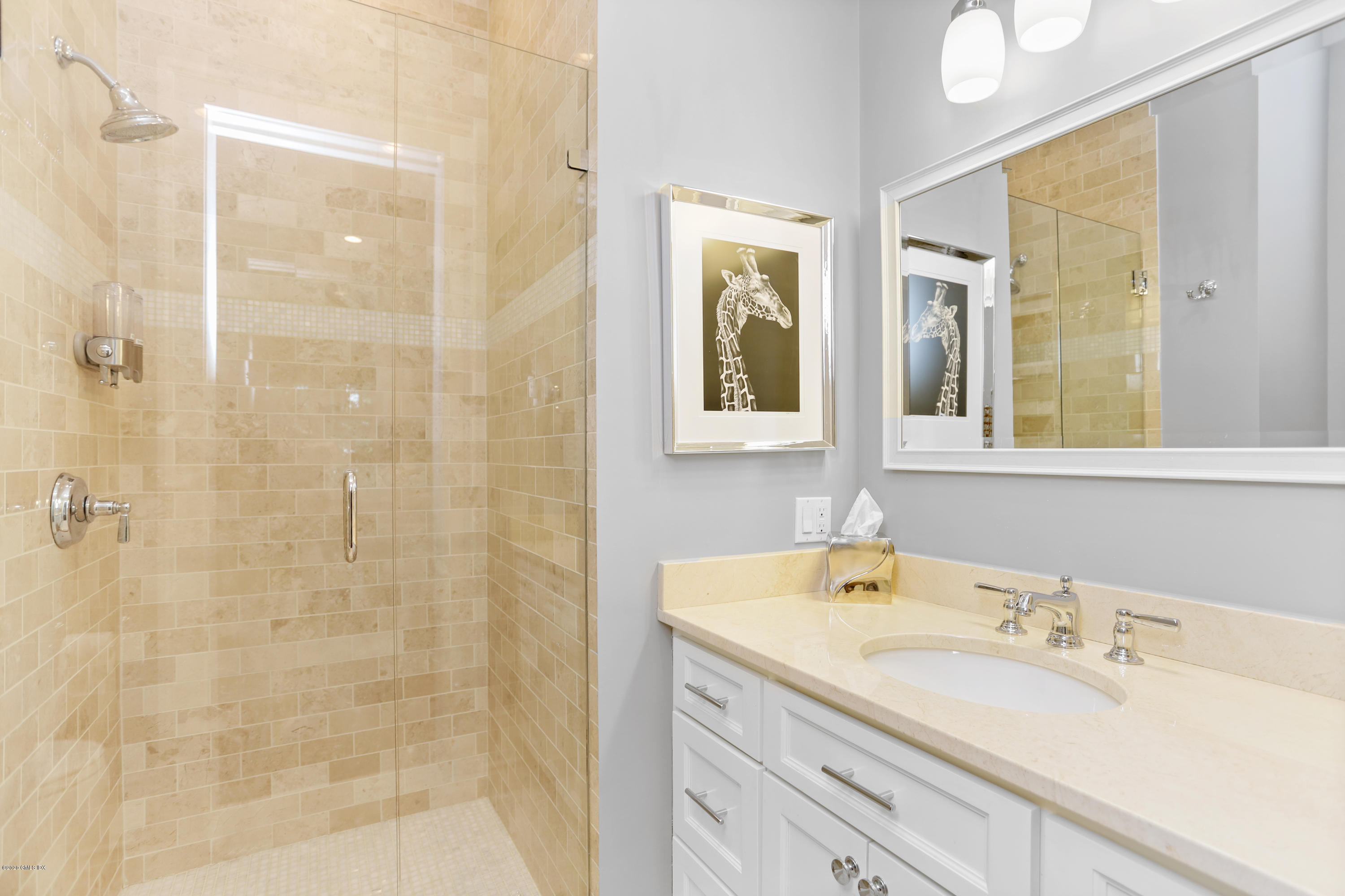 16 Center Road Old Greenwich, CT 06870 - Photo 15 of 35 a bathroom with a granite countertop sink a mirror and a shower