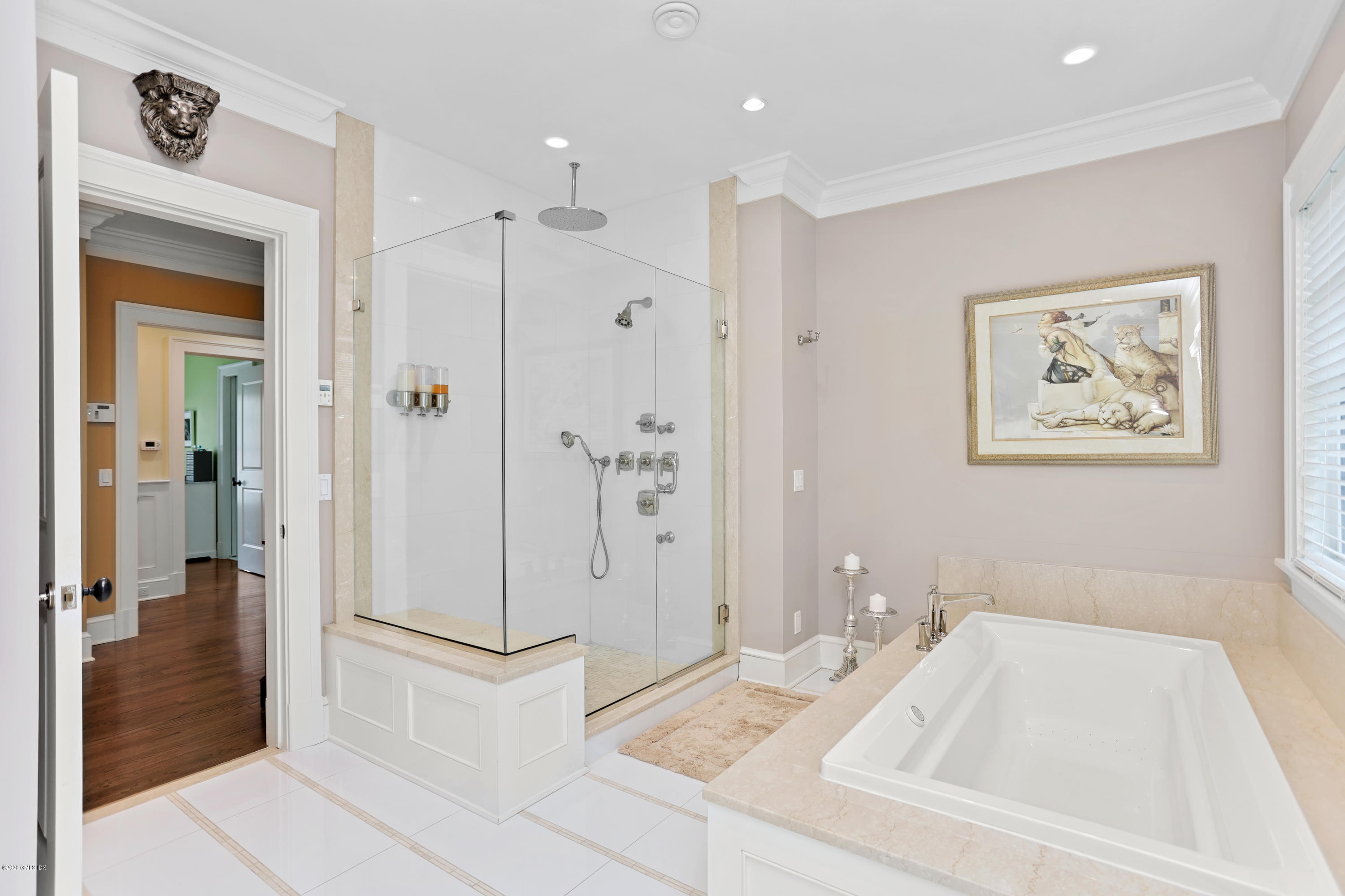 16 Center Road Old Greenwich, CT 06870 - Photo 20 of 35 a bathroom with a tub sink and mirror