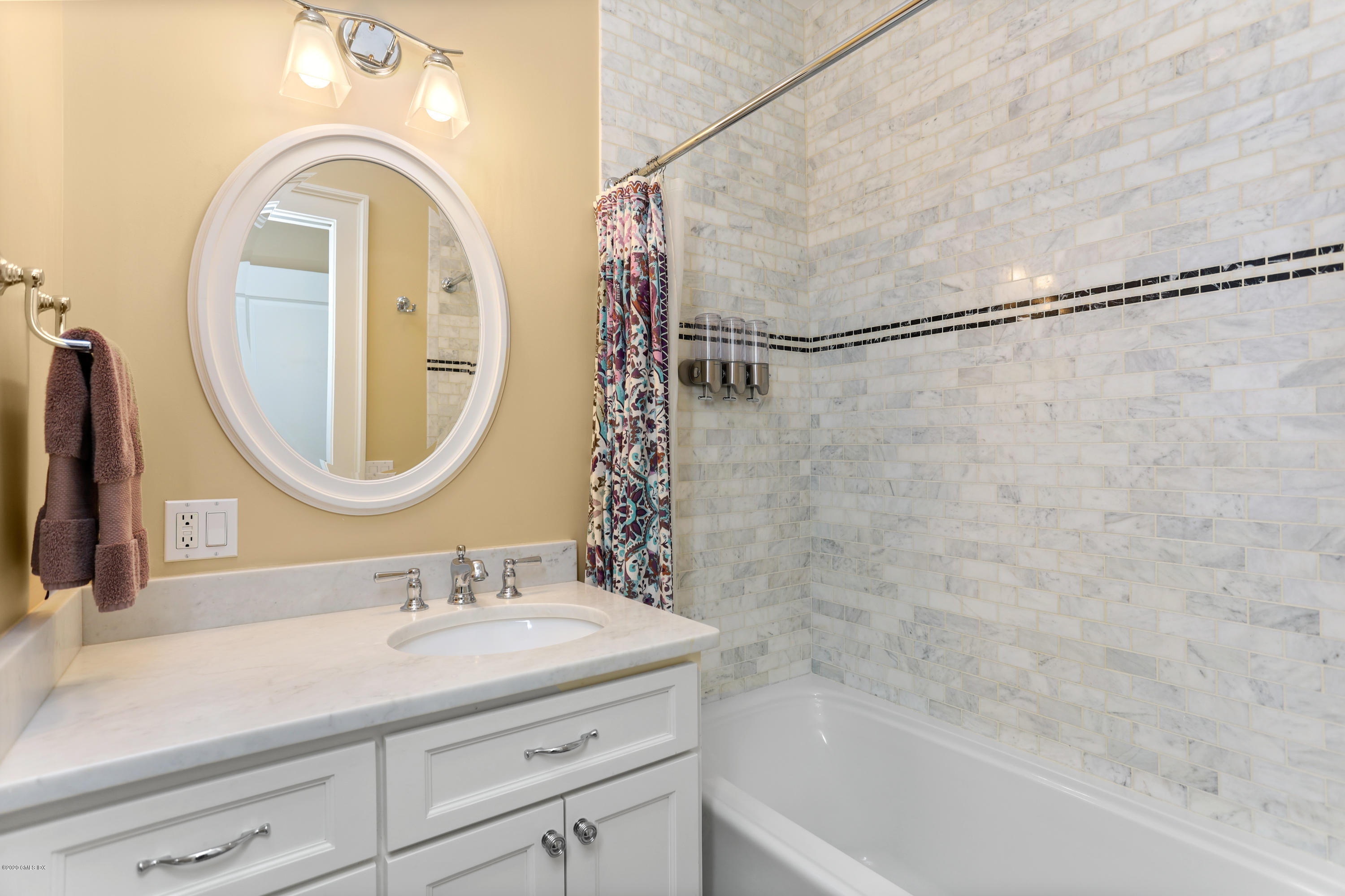 16 Center Road Old Greenwich, CT 06870 - Photo 25 of 35 a bathroom with a sink and a mirror