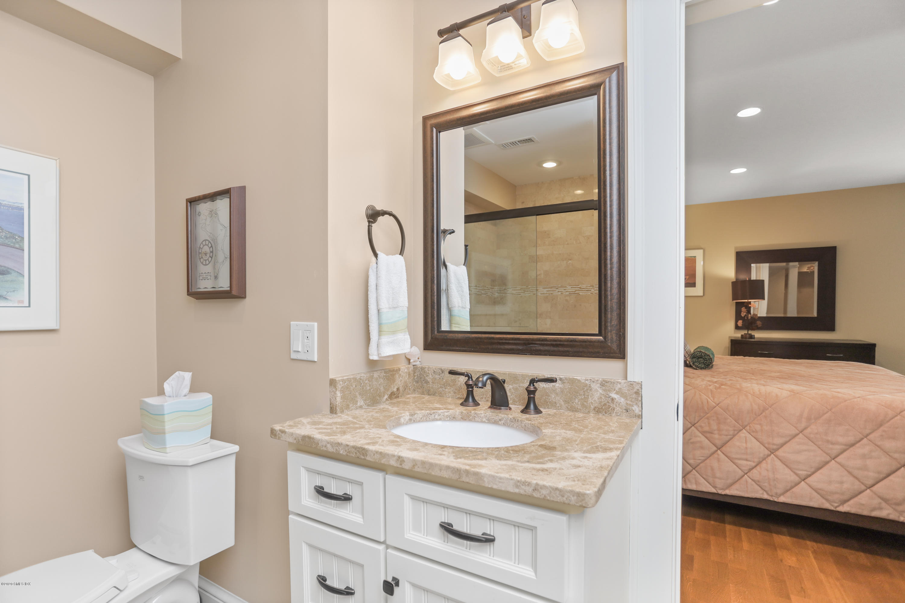 16 Center Road Old Greenwich, CT 06870 - Photo 32 of 35 a bathroom with a granite countertop sink and a mirror