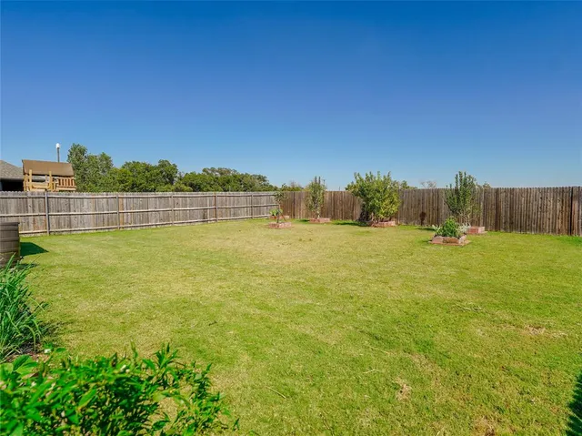 a view of a pool with a yard