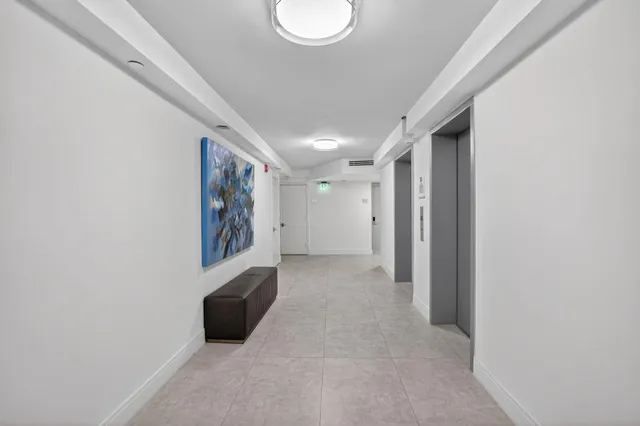 a view of a hallway to a bedroom