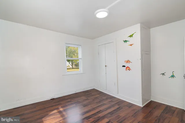 a view of hallway with wooden floor