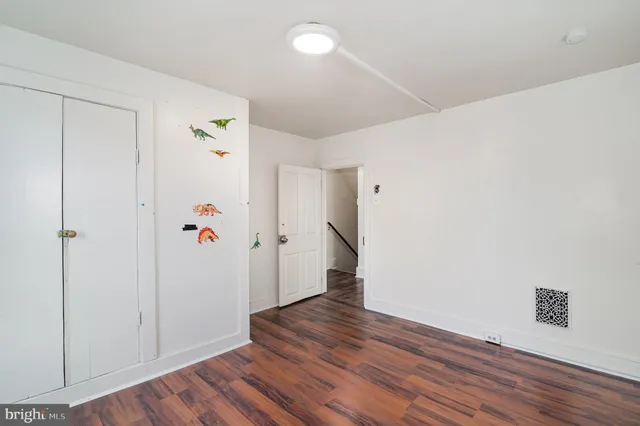 a view of hallway with wooden floor
