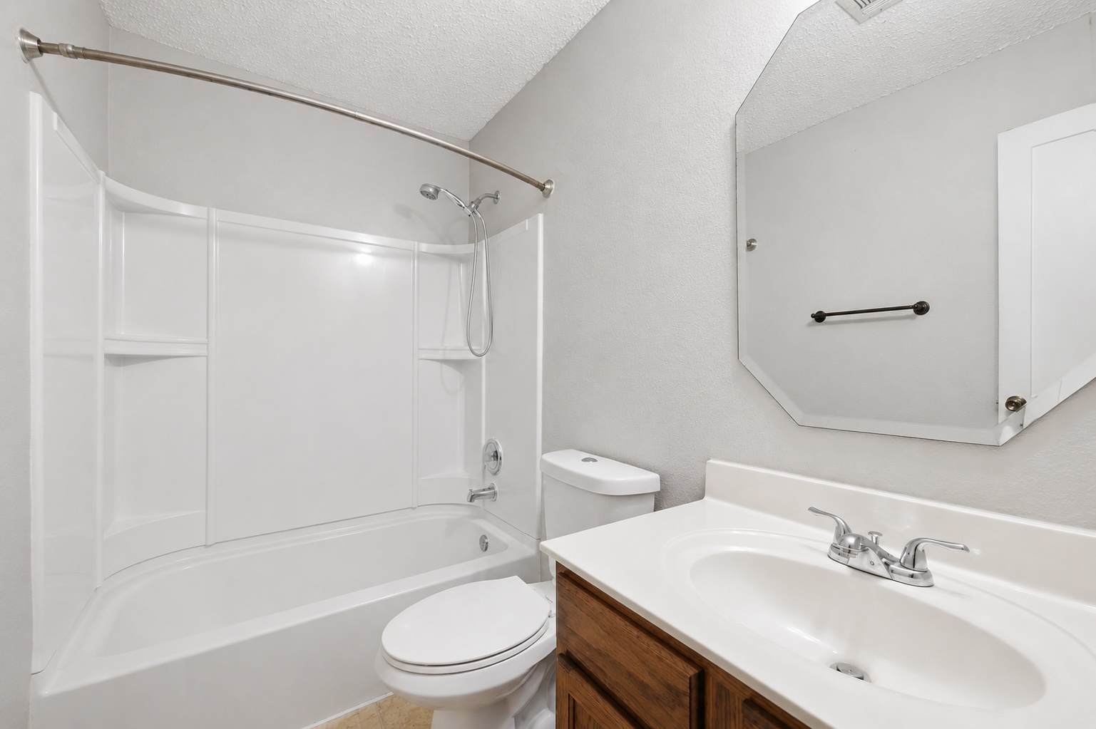 7900 Rosenberry Drive Austin, TX 78747 - Photo 16 of 27 A well-appointed bathroom with a sleek vanity and a shower-tub combination awaits.