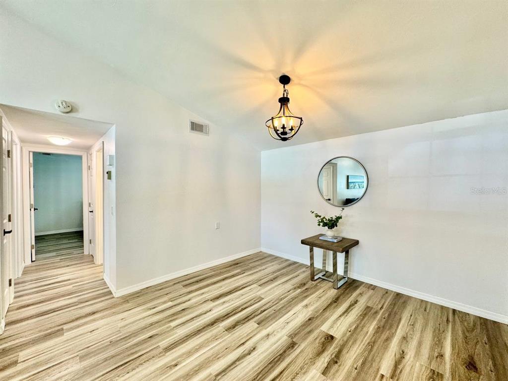 4282 Rudder Way New Port Richey, FL 34652 - Photo 11 of 34 a view of a room that has a table and chair