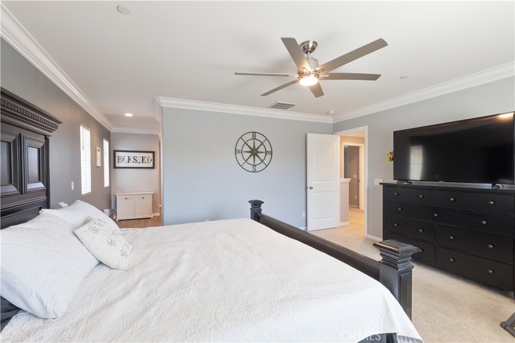 30283 Ramsay Drive Menifee, CA 92584 - Photo 13 of 24 a bedroom with a bed and a flat screen tv