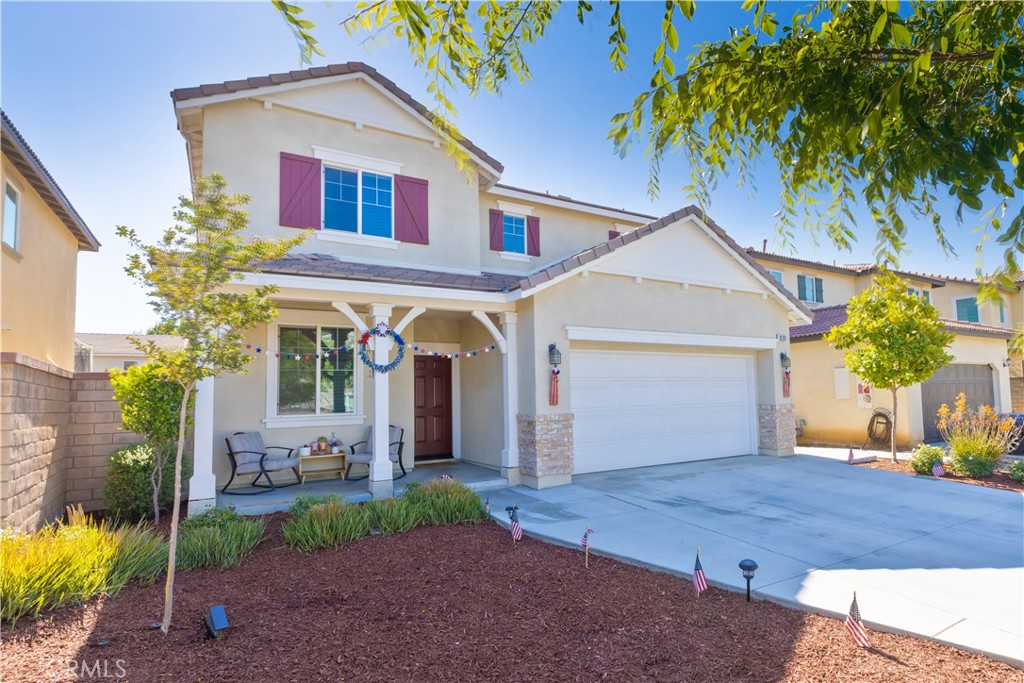 30283 Ramsay Drive Menifee, CA 92584 - Photo 2 of 24 a front view of a house with garden