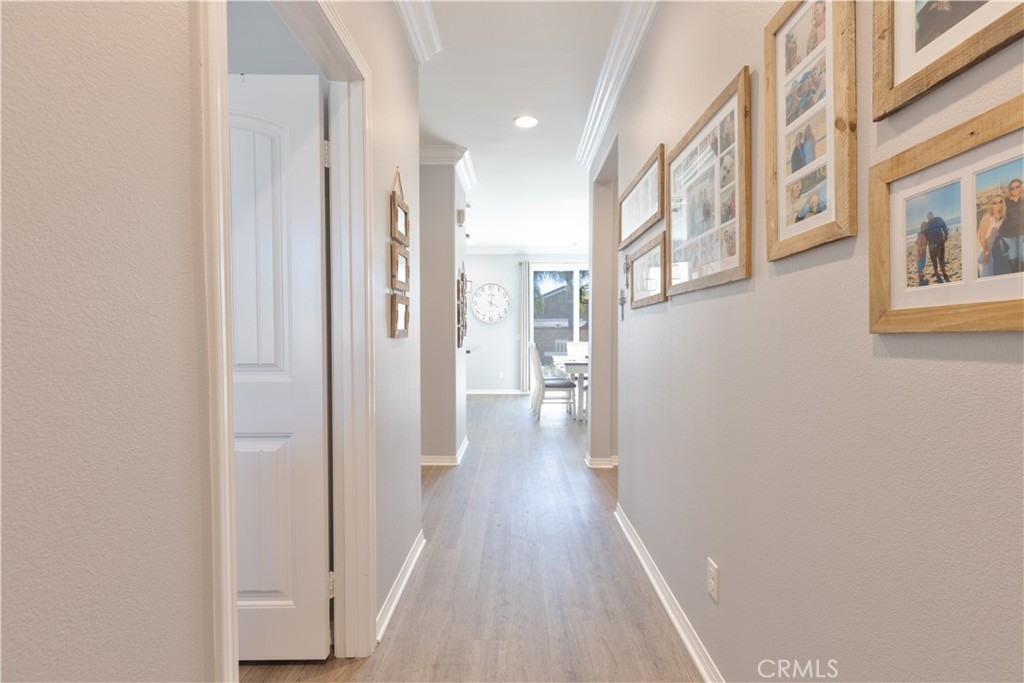 30283 Ramsay Drive Menifee, CA 92584 - Photo 4 of 24 a view of a hallway with wooden floor and staircase