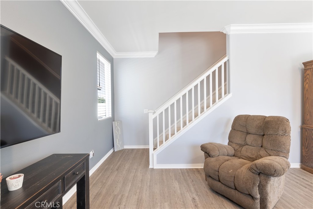 30283 Ramsay Drive Menifee, CA 92584 - Photo 10 of 24 a living room with furniture and a wooden floor