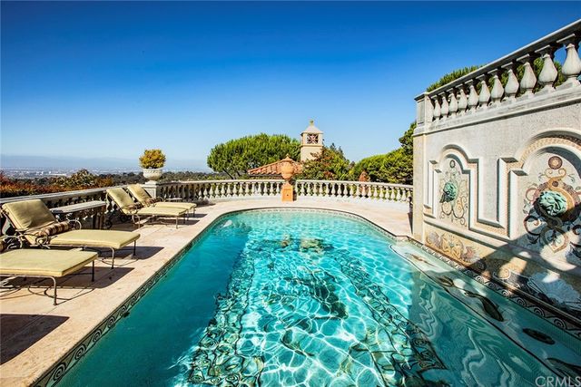a view of a chairs and table in a patio