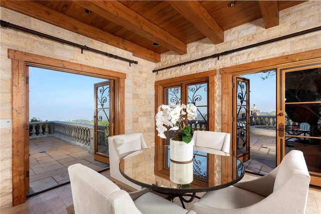 a view of a chairs and table in patio