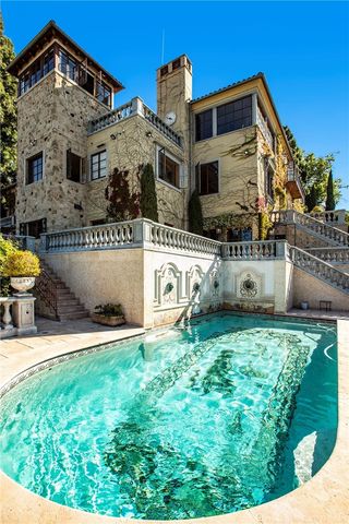 a view of a dining room with furniture and a kitchen