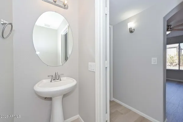 a view of a closet area with wooden floor