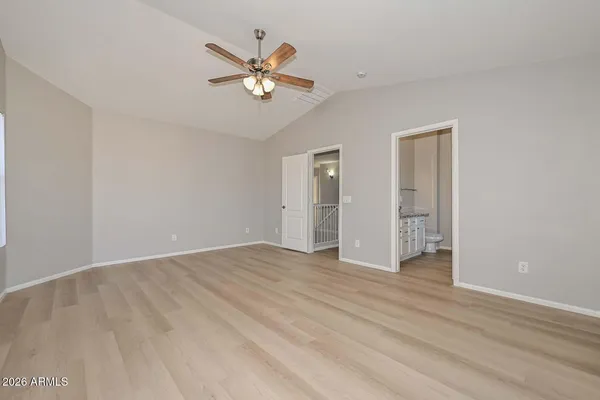 a bathroom with a granite countertop double vanity sink mirror and double