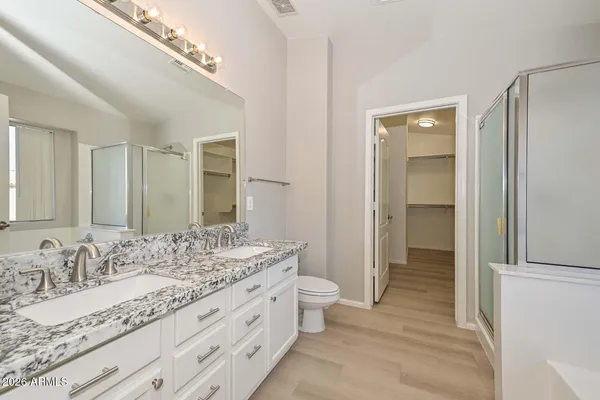 a bathroom with a tub and shower