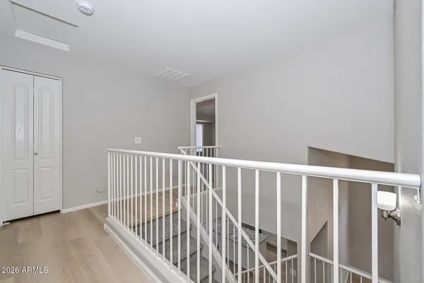 a view of gallery with wooden floor