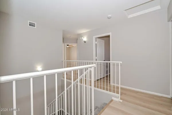 a bathroom with a granite countertop double vanity sink and a mirror