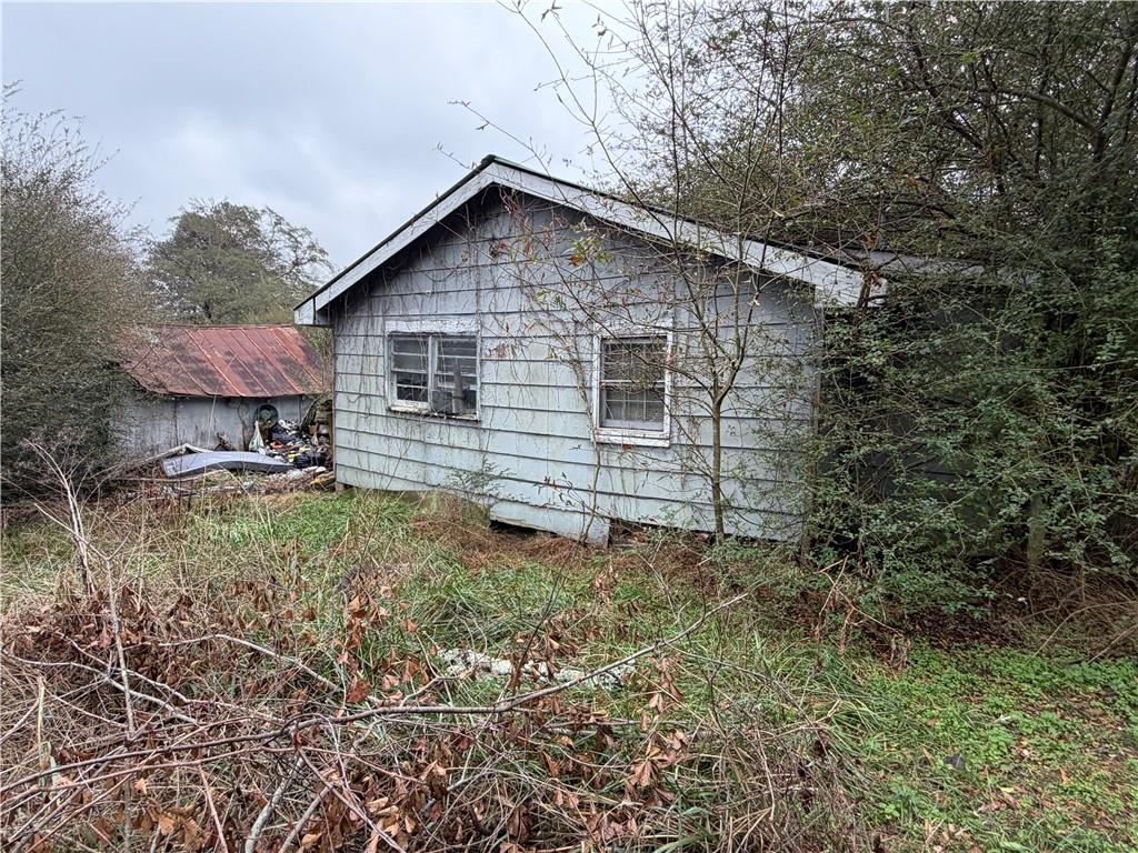 318 Morgan Valley Road Rockmart, GA 30153 - Photo 3 of 8 a backyard of a house with table and chairs