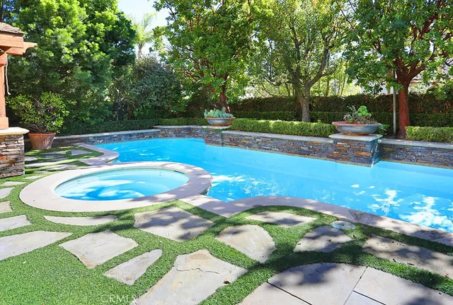 a view of a swimming pool with a patio