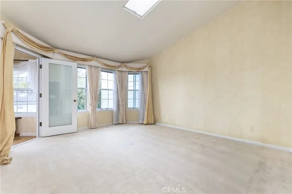 a kitchen with a stove a sink and cabinets
