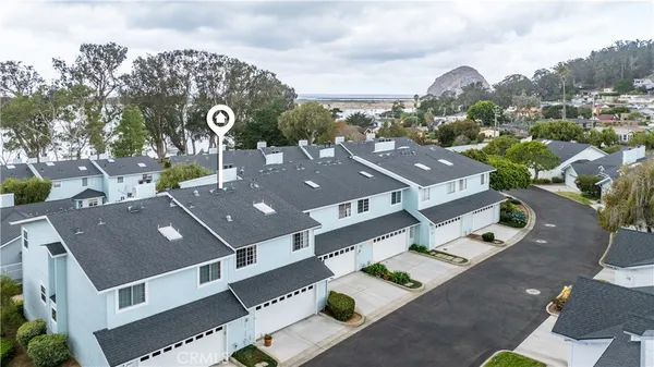 an aerial view of a house with garden space sitting space and swimming pool