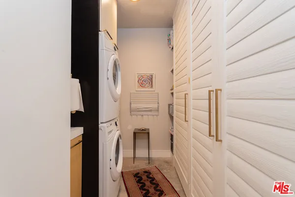 a bedroom with furniture and a mirror