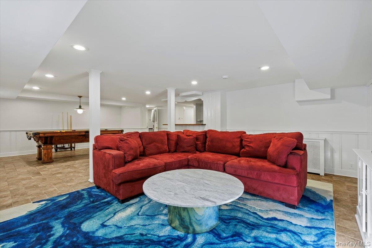 46 Fenimore Road Scarsdale, NY 10583 - Photo 29 of 35 Another view of the finished basement showing a TV lounge area (which could be used as an exercise area)