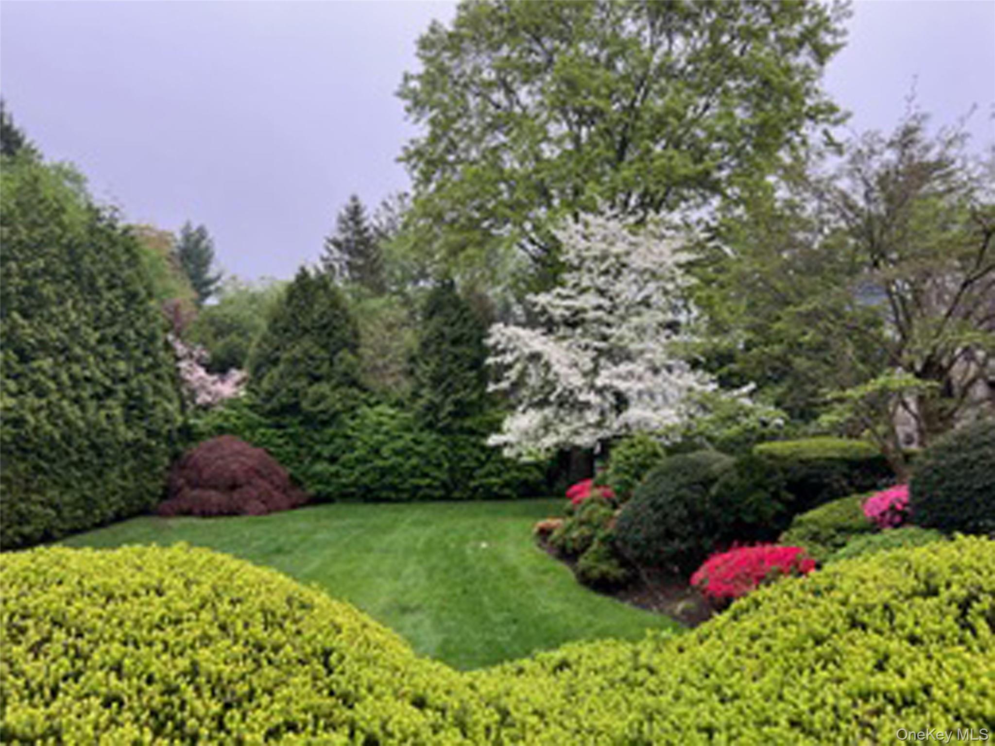 46 Fenimore Road Scarsdale, NY 10583 - Photo 4 of 35 Beautiful front gardens, with lush green lawn.