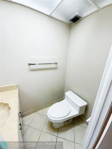a bathroom with a toilet and a sink