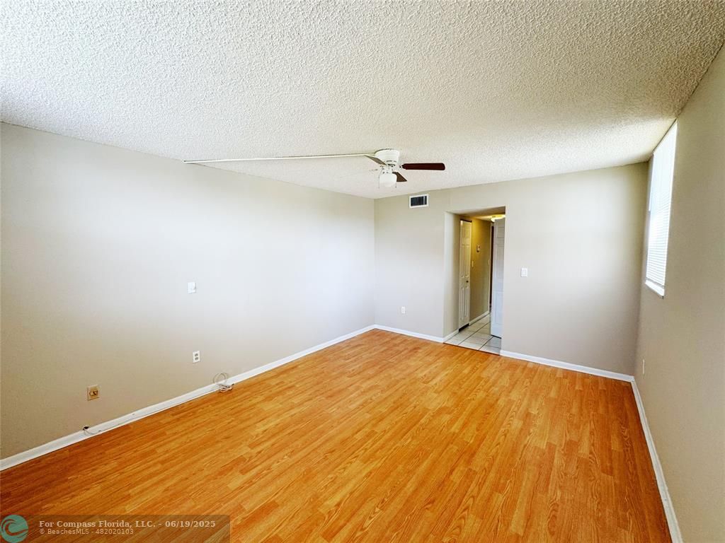 1820 Southwest 81st Avenue, Unit 3201 North Lauderdale, FL 33068 - Photo 14 of 20 a view of empty room with wooden floor