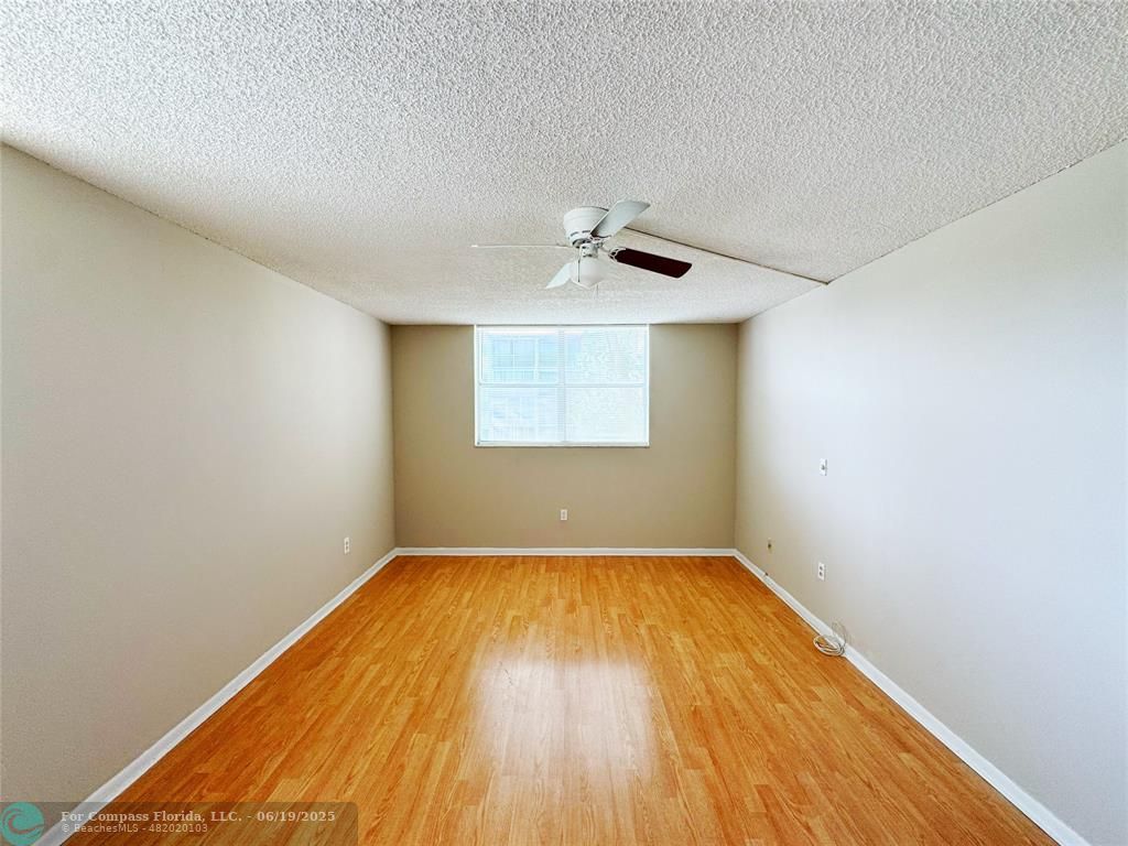 1820 Southwest 81st Avenue, Unit 3201 North Lauderdale, FL 33068 - Photo 15 of 20 a view of a big room with wooden floor and windows