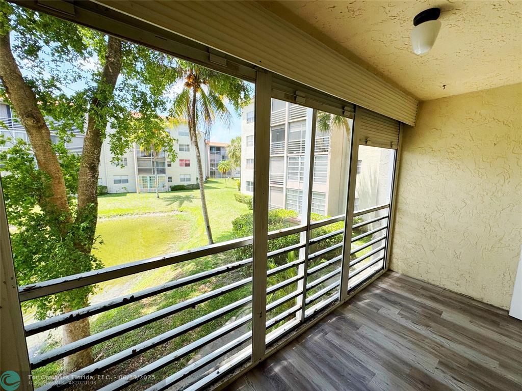 1820 Southwest 81st Avenue, Unit 3201 North Lauderdale, FL 33068 - Photo 19 of 20 a view of a large window with wooden floor