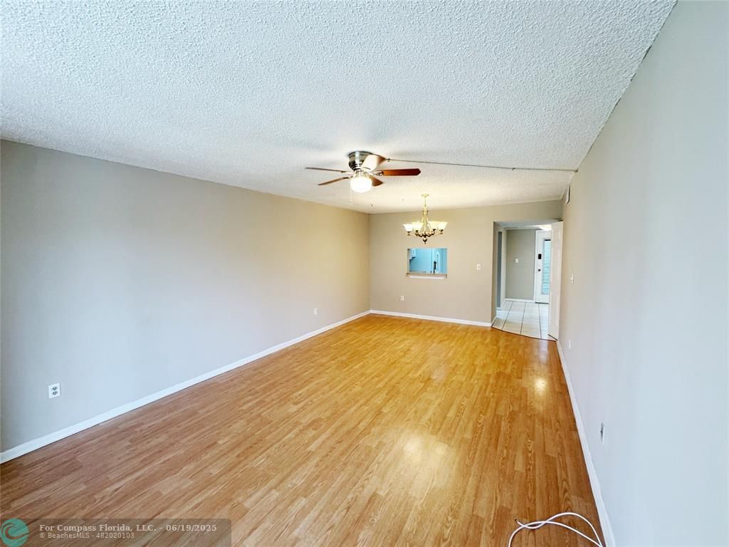 1820 Southwest 81st Avenue, Unit 3201 North Lauderdale, FL 33068 - Photo 9 of 20 wooden floor in an empty room