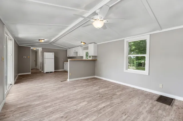 a view of kitchen with furniture and window