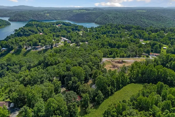 an aerial view of a houses with yard