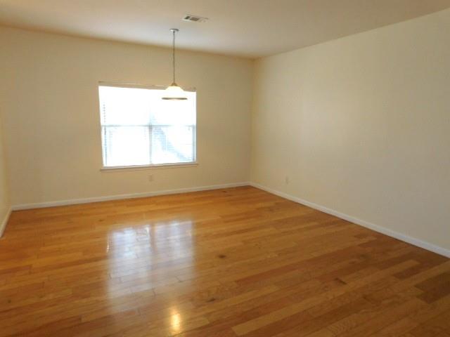4304 Defoors Farm Trail Powder Springs, GA 30127 - Photo 17 of 41 an empty room with wooden floor and windows