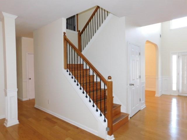 4304 Defoors Farm Trail Powder Springs, GA 30127 - Photo 18 of 41 a view of a hallway with wooden floor and entryway
