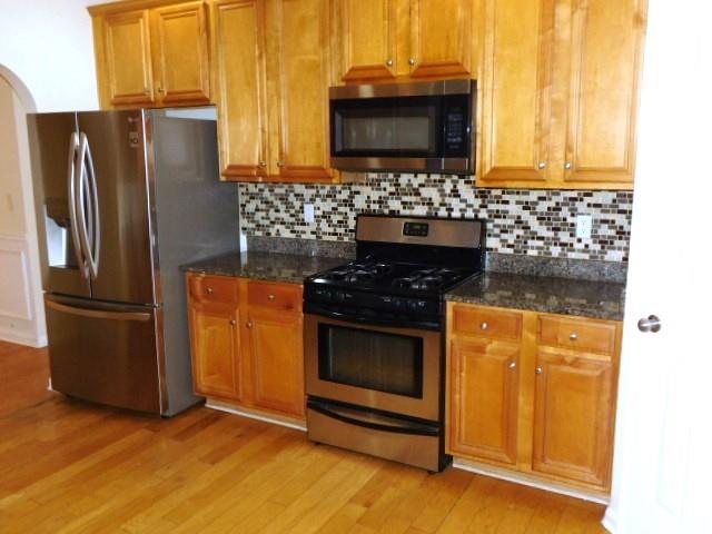 4304 Defoors Farm Trail Powder Springs, GA 30127 - Photo 31 of 41 a kitchen with windows and a refrigerator