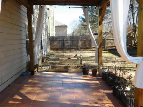 a view of a park with iron fence